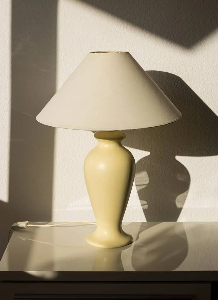 Fabric-shaded lamp in raking light